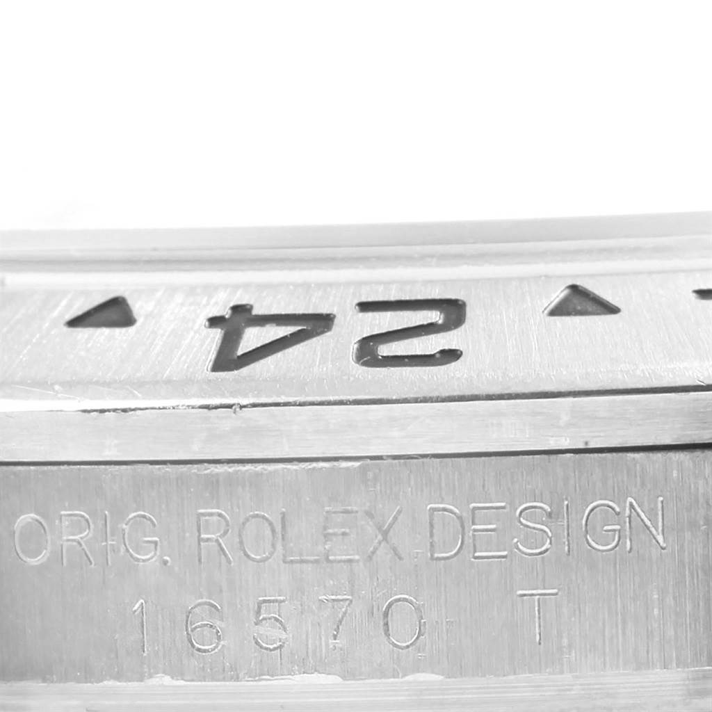 The image shows a close-up angle of the bezel and case side of a Rolex Explorer 16570 Men's Stainless Steel Black Dial 16570 Men's Stainless Steel Black Dial, with the model number 16570 engraved.