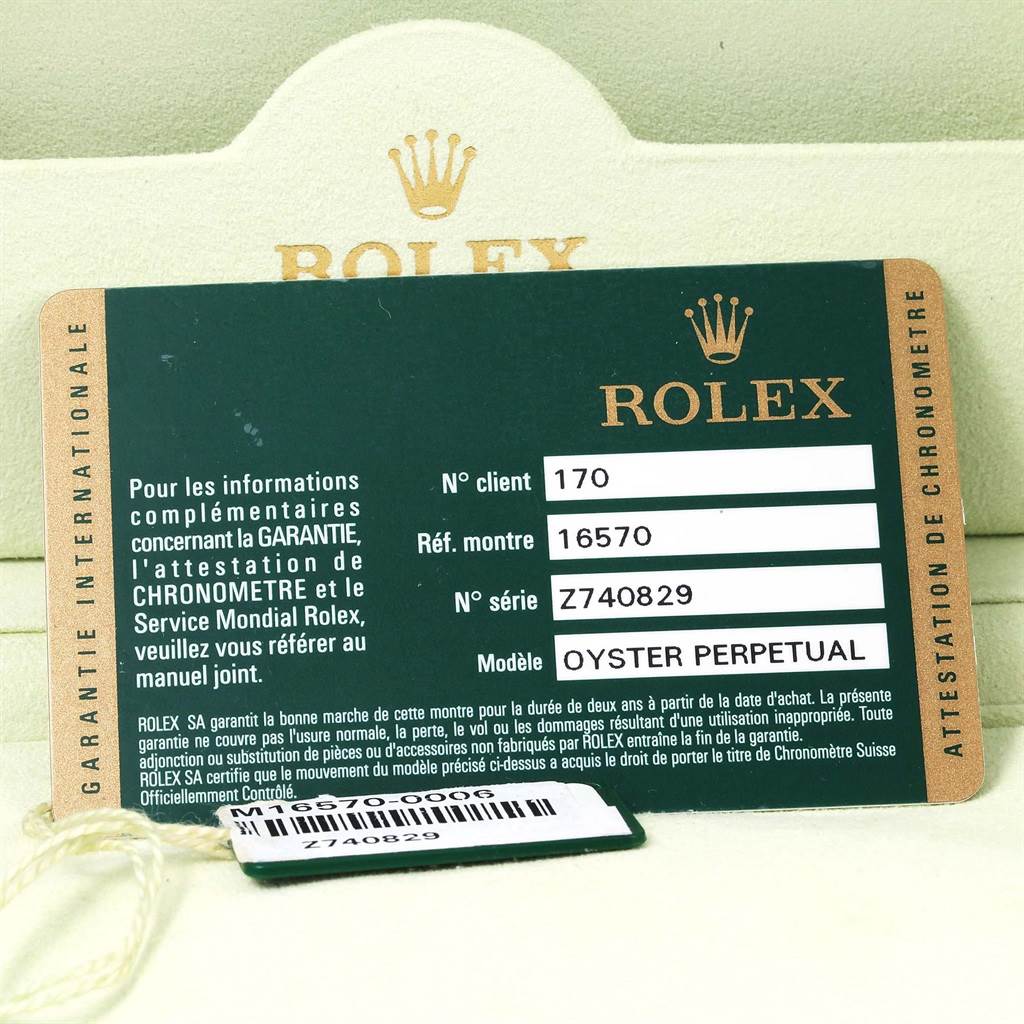 The image showcases the warranty card and tag for the Rolex Explorer 16570 Men's Stainless Steel Black Dial 16570 Men's Stainless Steel Black Dial model, featuring model and serial numbers.
