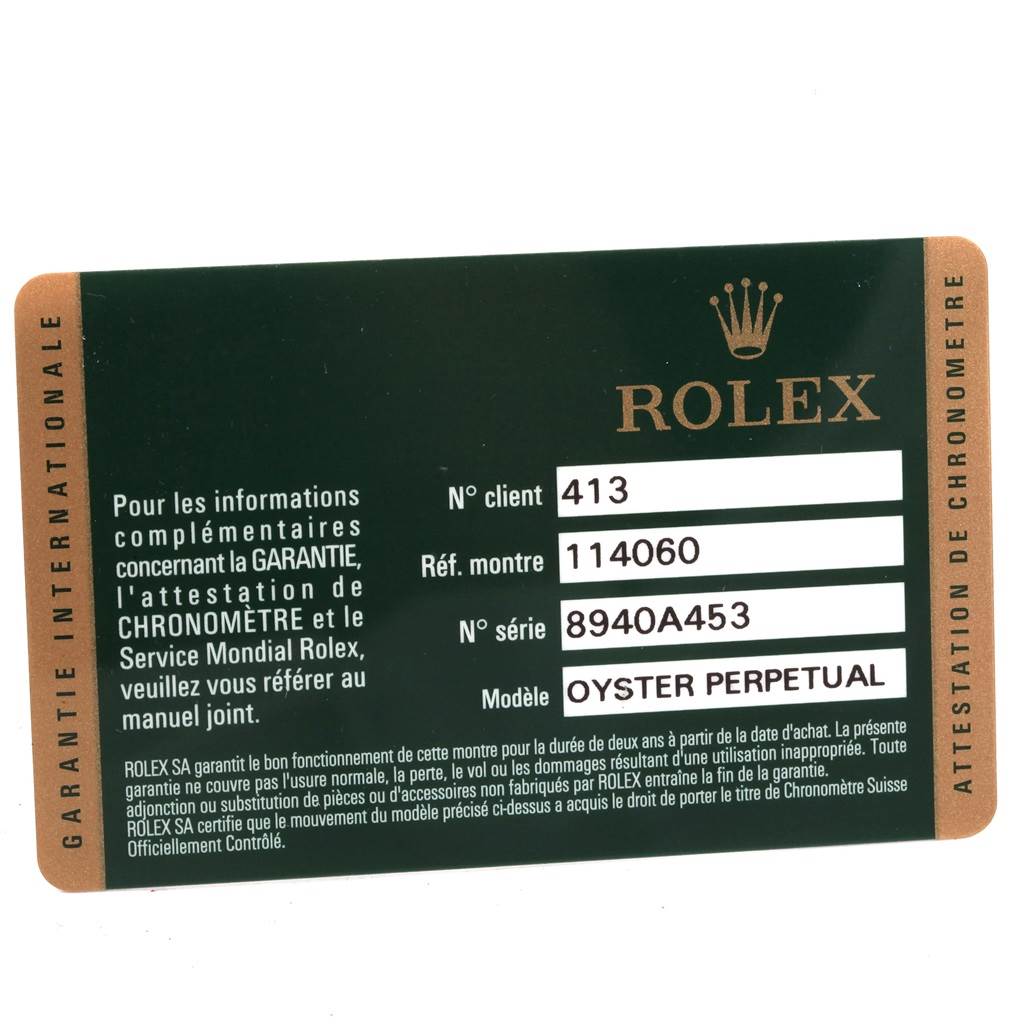 The image shows the warranty card for a Rolex Explorer 114060 Men's Stainless Steel Black Dial 114060 Men's Stainless Steel Black Dial model, displaying information like the model number, reference number, and serial number.