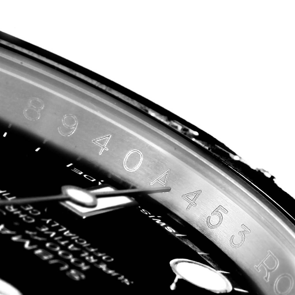 This image shows a close-up of the Rolex Explorer 114060 Men's Stainless Steel Black Dial 114060 Men's Stainless Steel Black Dial watch, zooming in on the dial, hands, and engraved numbering on the chapter ring.