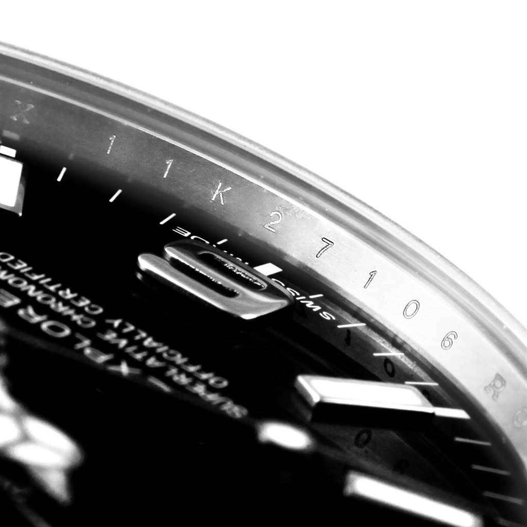 This close-up angle of the Rolex Explorer 214270 Men's Stainless Steel Black Dial 214270 Men's Stainless Steel Black Dial watch shows the dial, hands, and parts of the rehaut and bezel.