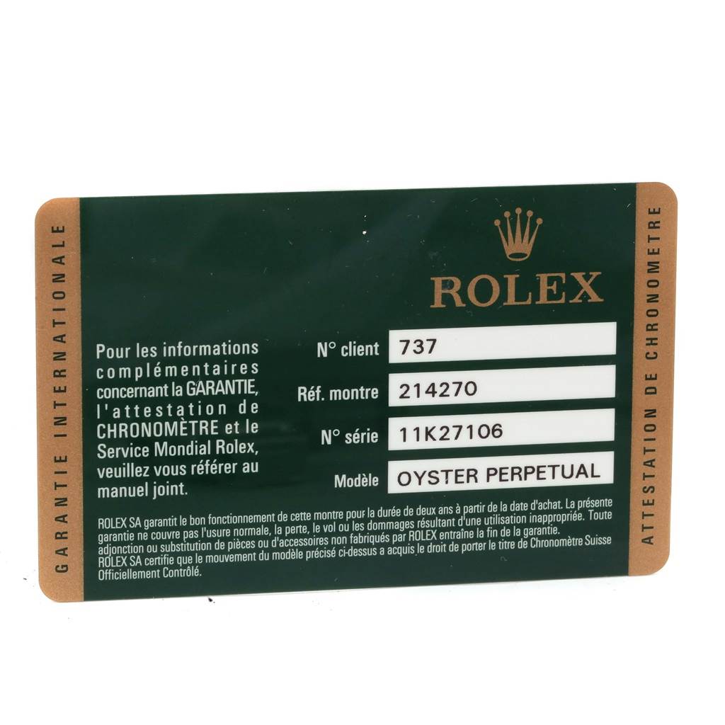 This image shows an international warranty card for a Rolex Explorer 214270 Men's Stainless Steel Black Dial 214270 Men's Stainless Steel Black Dial model watch with reference number 214270.