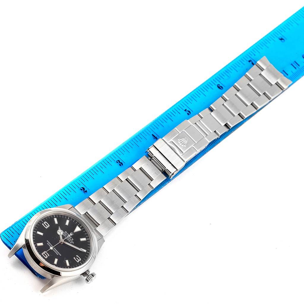 The Rolex Explorer 14270 Men's Stainless Steel Black Dial 14270 Men's Stainless Steel Black Dial watch is shown from the top, featuring its black dial, stainless steel case, and bracelet with a clasp.