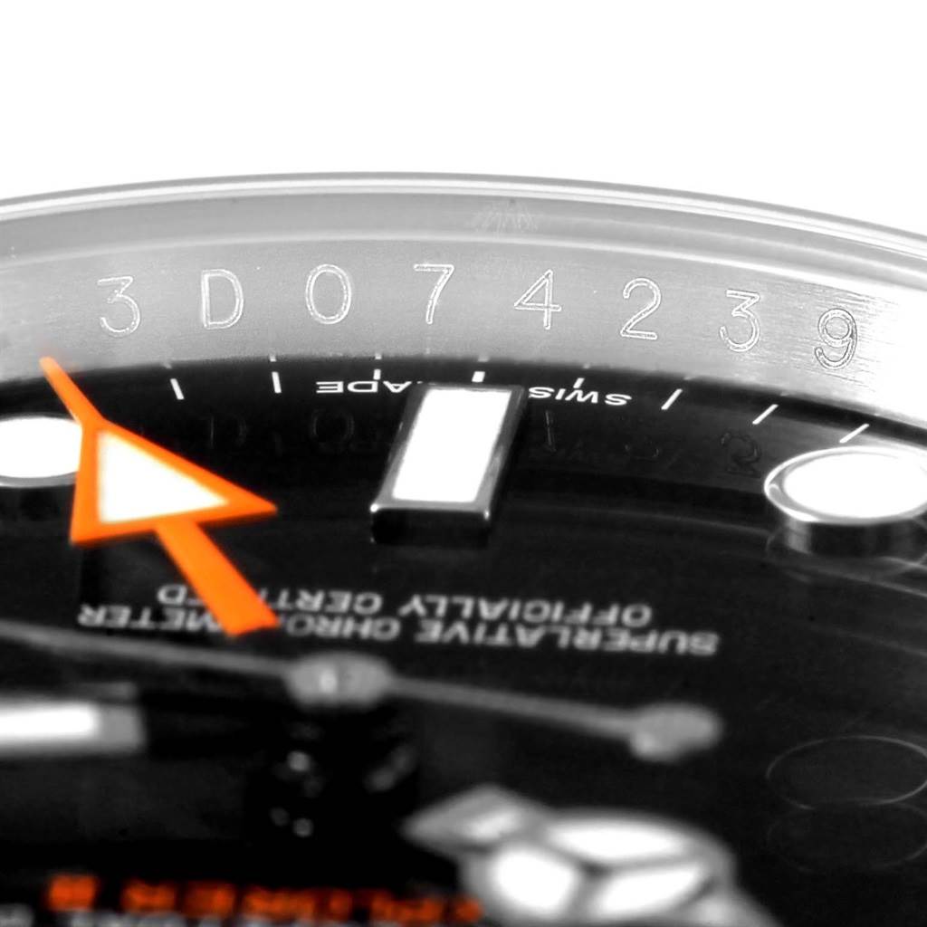 This close-up image focuses on the upper dial and serial number engraving of a Rolex Explorer 216570 Men's Stainless Steel Black Dial 216570 Men's Stainless Steel Black Dial model watch.