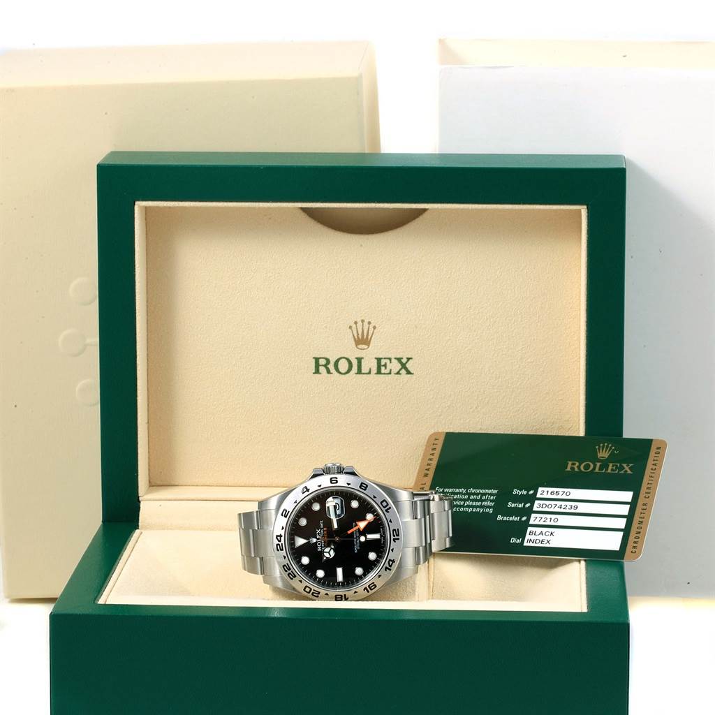 The image shows the front view of a Rolex Explorer 216570 Men's Stainless Steel Black Dial 216570 Men's Stainless Steel Black Dial watch with its box and certification card.