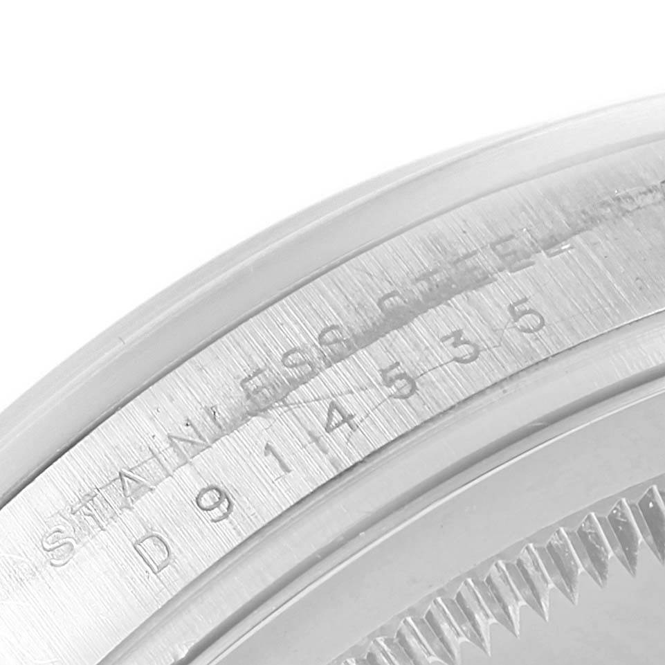 This image shows a close-up of the serial and model numbers engraved on the side of the case of the Rolex Explorer 114270 Men's Stainless Steel Black Dial 114270 Men's Stainless Steel Black Dial watch.