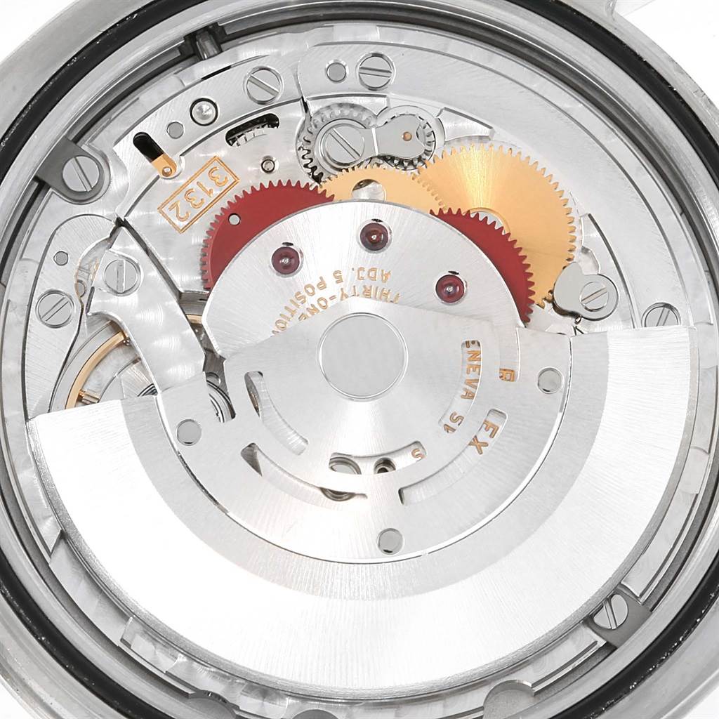 The image shows a close-up view of the internal mechanism of a Rolex Explorer 214270 Men's Stainless Steel Black Dial 214270 Men's Stainless Steel Black Dial watch, highlighting gears and the rotor.