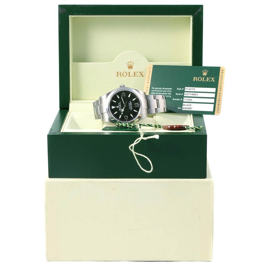 This image shows a Rolex Explorer 214270 Men's Stainless Steel Black Dial 214270 Men's Stainless Steel Black Dial watch in its box with a warranty card and tags, viewed from the front.
