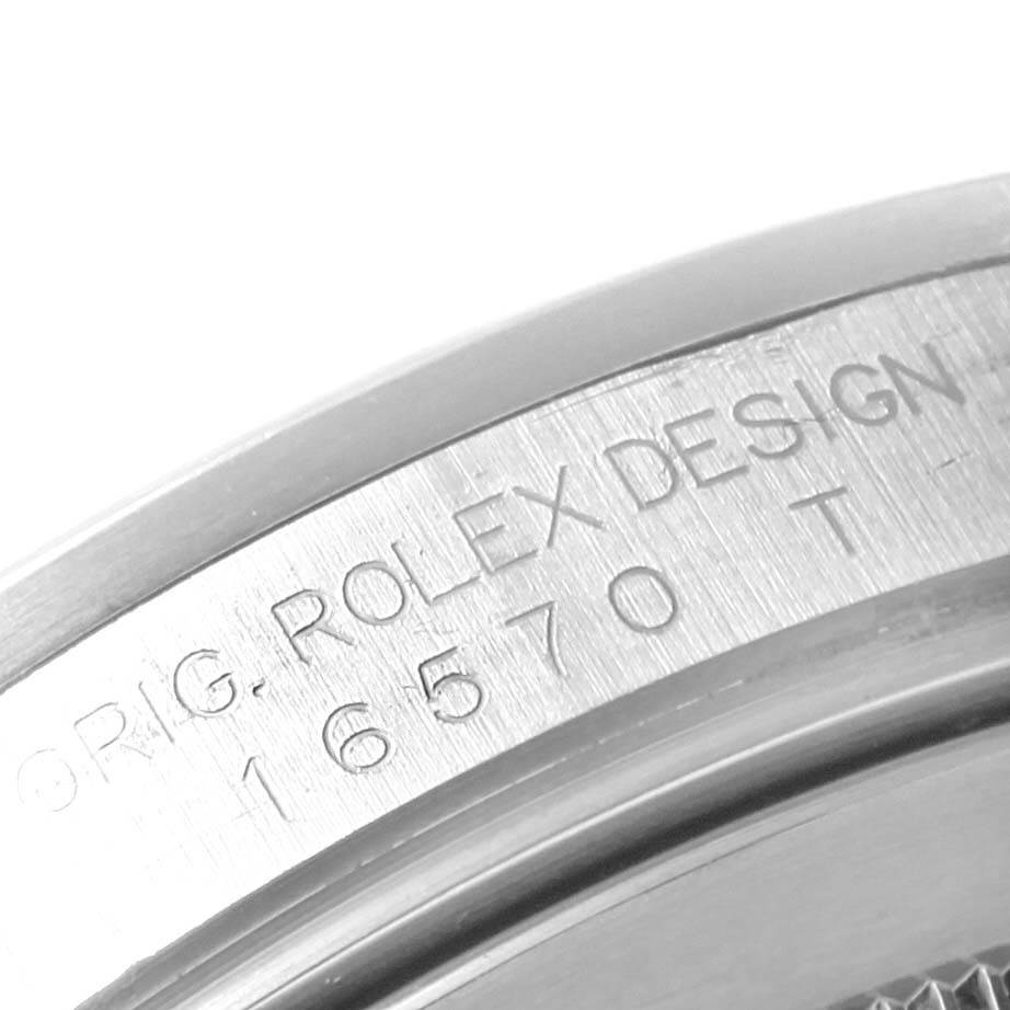 The image shows a close-up of the engraved side of the case on a Rolex Explorer 16570 Men's Stainless Steel Black Dial 16570 Men's Stainless Steel Black Dial watch.