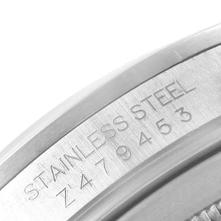 This close-up image shows the stainless steel case with engraved serial number of the Rolex Explorer 16570 Men's Stainless Steel Black Dial 16570 Men's Stainless Steel Black Dial watch.