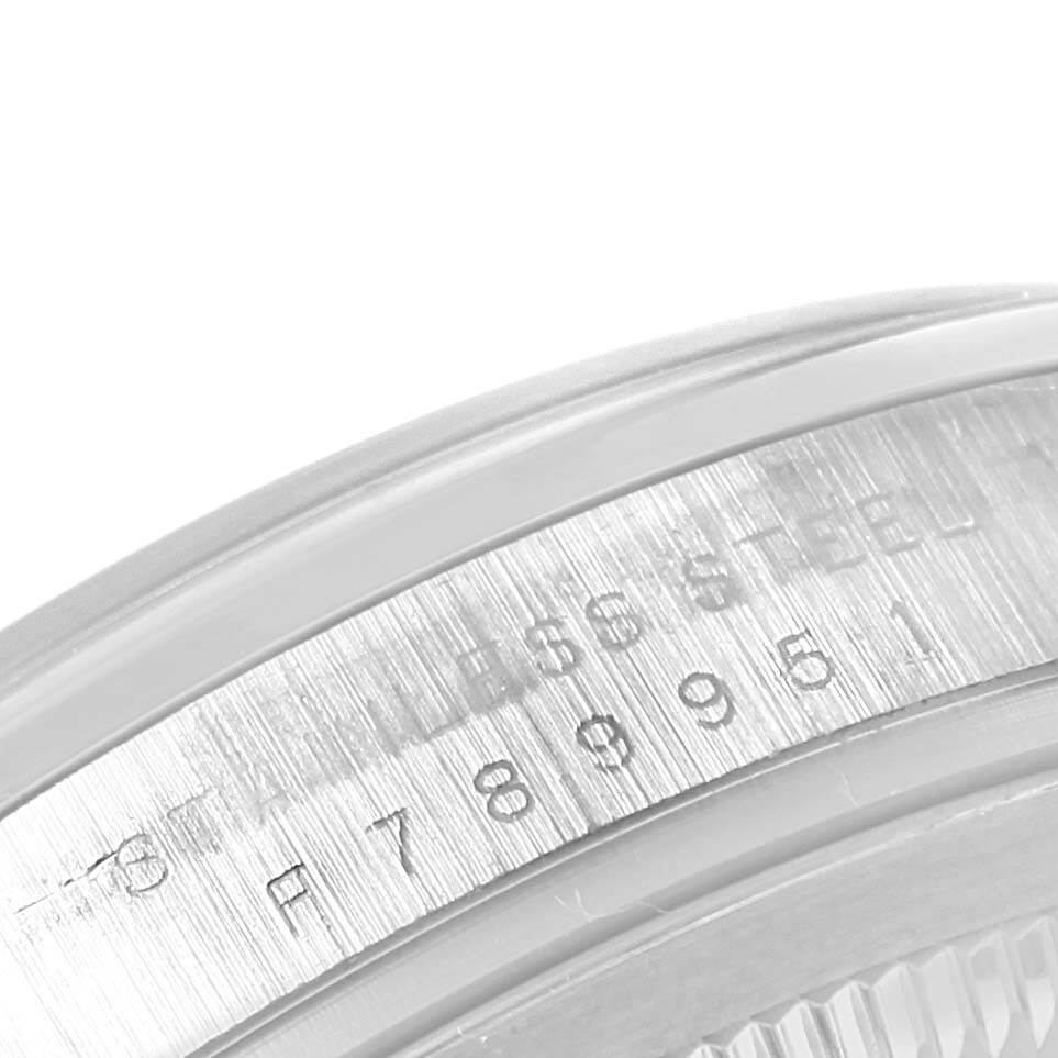 The image shows a close-up of the serial number and "STAINLESS STEEL" engraving on the case side of a Rolex Explorer 114270 Men's Stainless Steel Black Dial 114270 Men's Stainless Steel Black Dial watch.