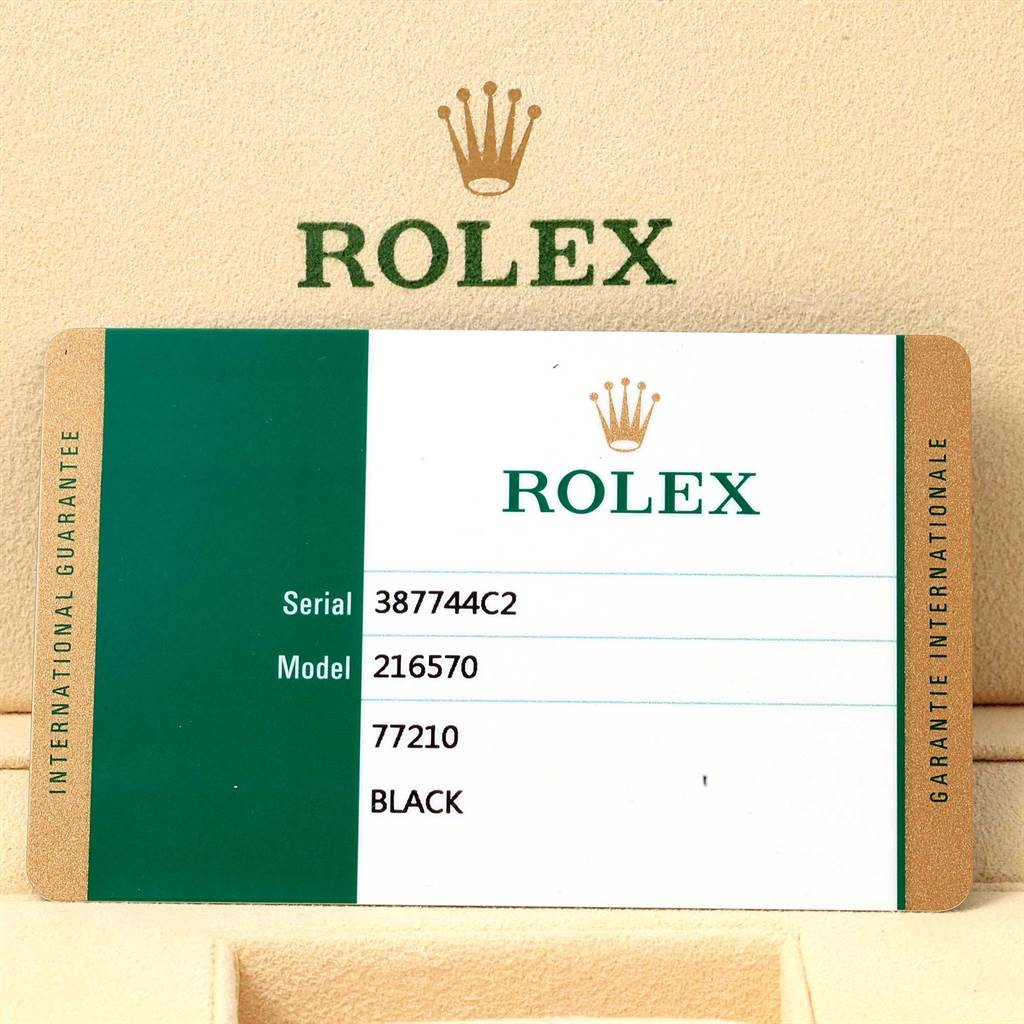 The image shows an international guarantee card for a Rolex Explorer 216570 Men
s Stainless Steel Black Dial 216570 Men
s Stainless Steel Black Dial model 216570 with serial number 387744C2.