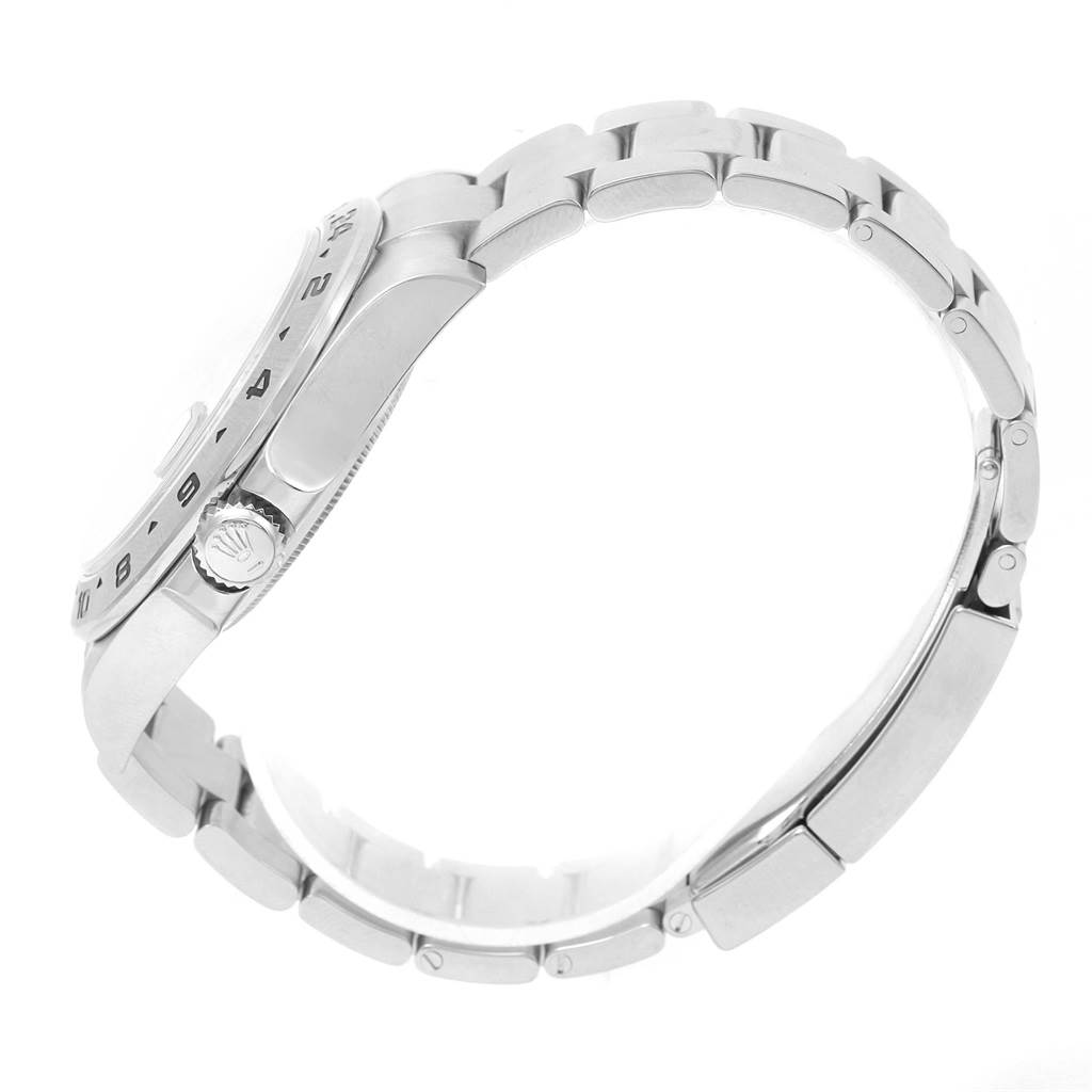 The image shows a side view of a Rolex Explorer 216570 Men
s Stainless Steel Black Dial 216570 Men
s Stainless Steel Black Dial watch, highlighting its bracelet, crown, and part of the bezel.