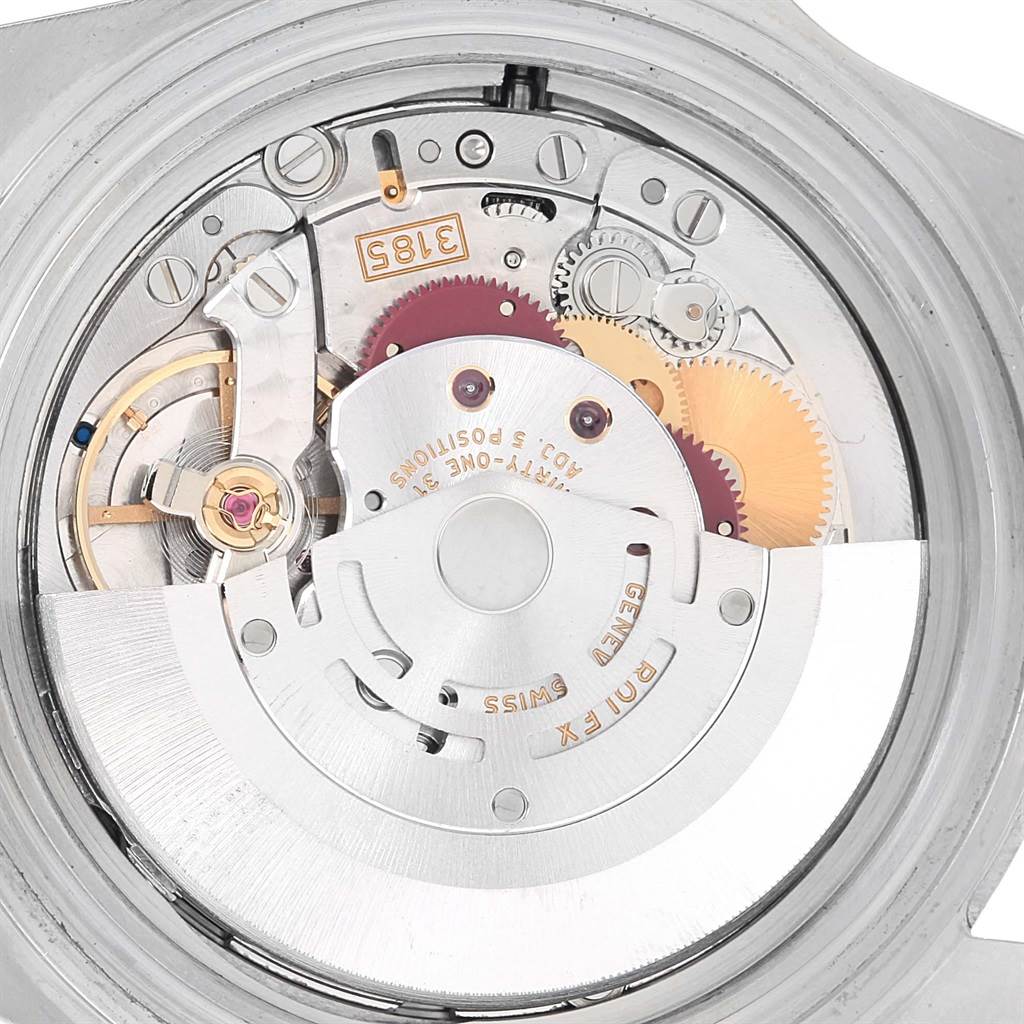 The image shows the internal mechanics of a Rolex Explorer 16570 Men's Stainless Steel Black Dial 16570 Men's Stainless Steel Black Dial watch, viewed from the back, highlighting gears and the balance wheel.