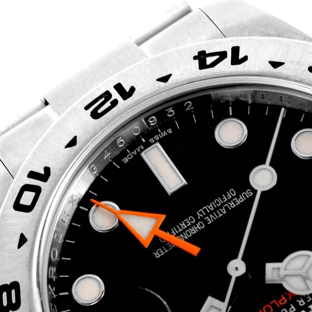 This close-up shows the dial, bezel, and part of the band of the Rolex Explorer 216570 Men's Stainless Steel Black Dial 216570 Men's Stainless Steel Black Dial watch.