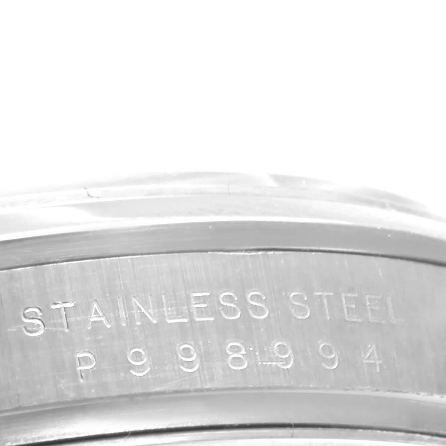 The image shows a close-up of the case back edge with "STAINLESS STEEL" engraved on a Rolex Explorer 114270 Men's Stainless Steel Black Dial 114270 Men's Stainless Steel Black Dial watch.