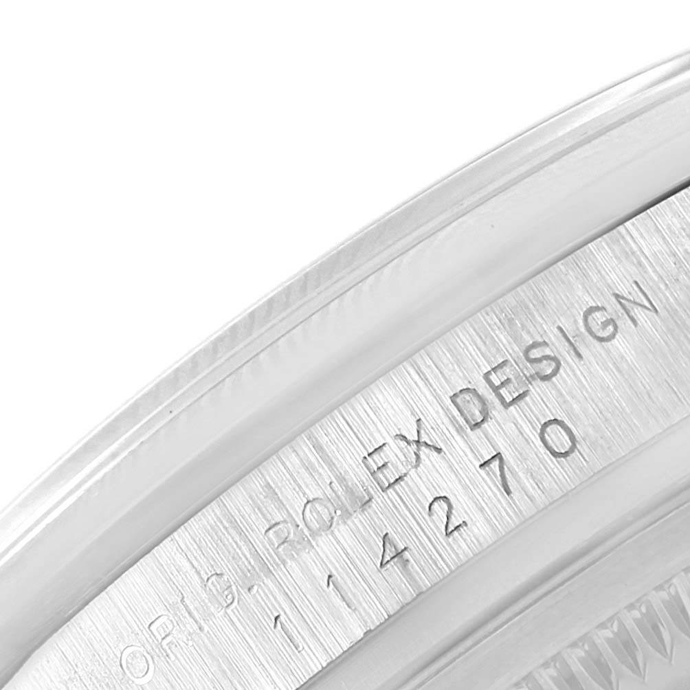 This image shows a close-up of the side view of the Rolex Explorer 114270 Men's Stainless Steel Black Dial 114270 Men's Stainless Steel Black Dial model, highlighting the "ORIG. ROLEX DESIGN" engraving.