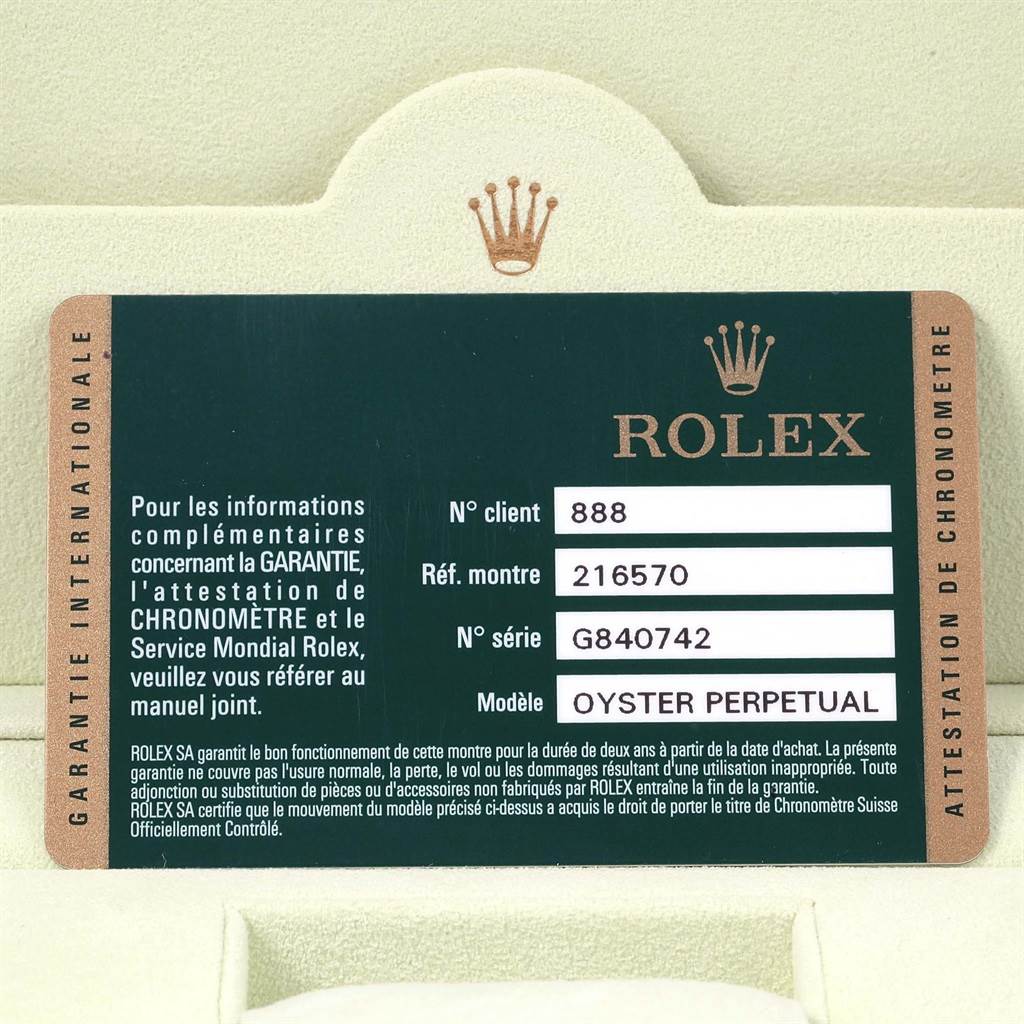 This image shows the warranty card for a Rolex Explorer 216570 Men's Stainless Steel White Dial 216570 Men's Stainless Steel White Dial model watch, displaying client number, watch reference, and serial number.