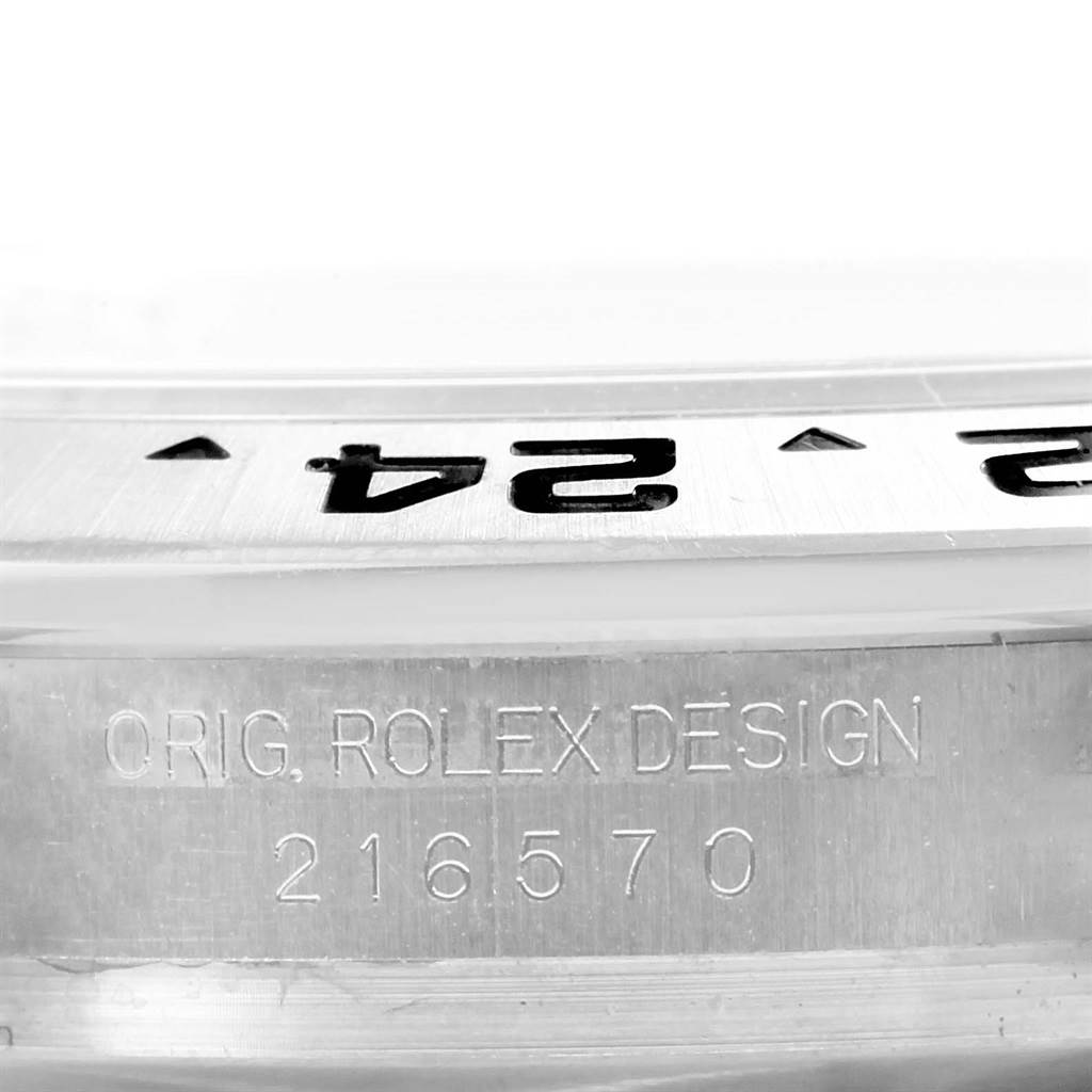 This close-up shows the engraved bezel and the "ORIG. ROLEX DESIGN 216570" text on the Rolex Explorer 216570 Men's Stainless Steel White Dial 216570 Men's Stainless Steel White Dial watch case.
