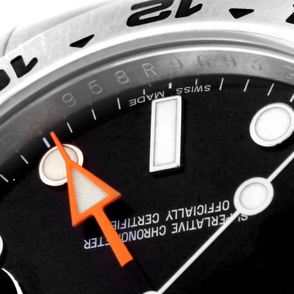 The image shows a close-up of the dial and part of the bezel of the Rolex Explorer 216570 Men's Stainless Steel Black Dial 216570 Men's Stainless Steel Black Dial watch, including the hour markers and an orange hand.