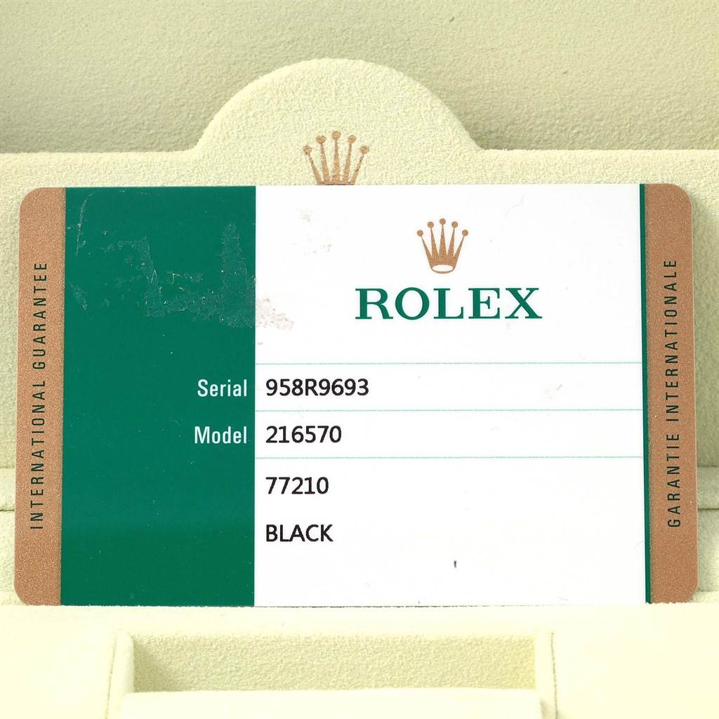 This image shows an international guarantee card for a Rolex Explorer 216570 Men's Stainless Steel Black Dial 216570 Men's Stainless Steel Black Dial model 216570 watch.
