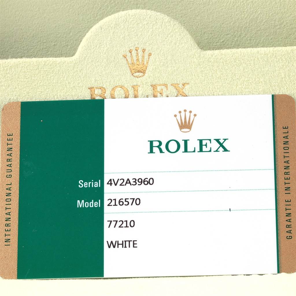 This image shows the international guarantee card for a Rolex Explorer 216570 Men's Stainless Steel White Dial 216570 Men's Stainless Steel White Dial model 216570 in white.
