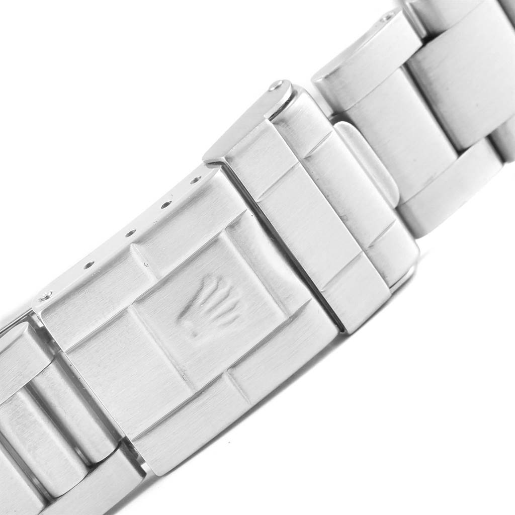 This image shows a close-up of the clasp and part of the bracelet of a Rolex Explorer 16570 Men's Stainless Steel White Dial 16570 Men's Stainless Steel White Dial watch.