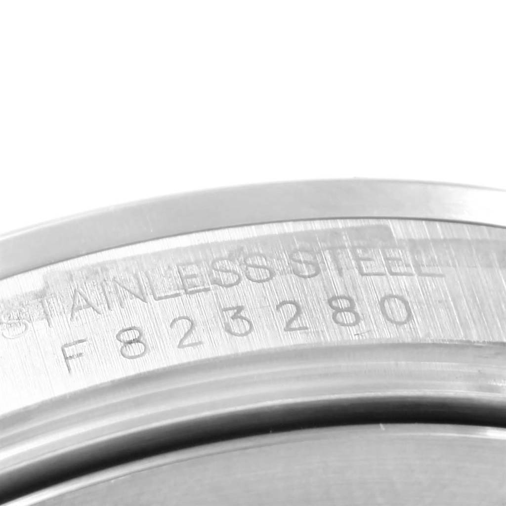 This image shows the close-up of the serial and model number engraved on the stainless steel case of a Rolex Explorer 16570 Men's Stainless Steel White Dial 16570 Men's Stainless Steel White Dial watch.