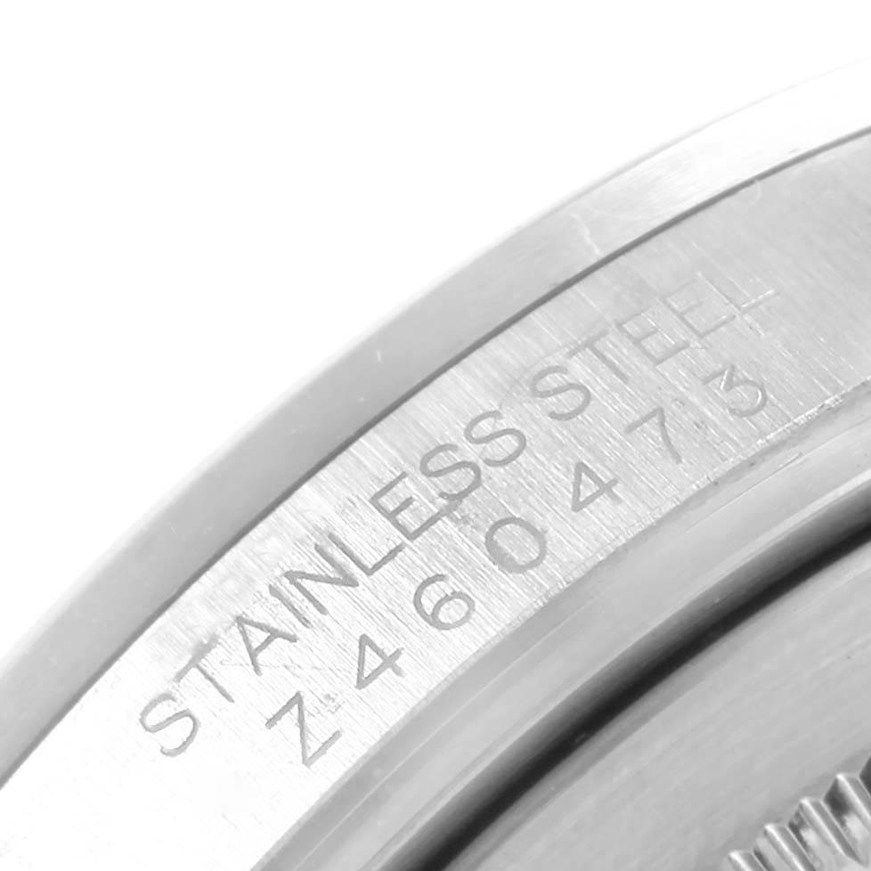 The image shows a close-up angle of the stainless steel case back and engraved serial number of a Rolex Explorer 16570 Men's Stainless Steel White Dial 16570 Men's Stainless Steel White Dial watch.