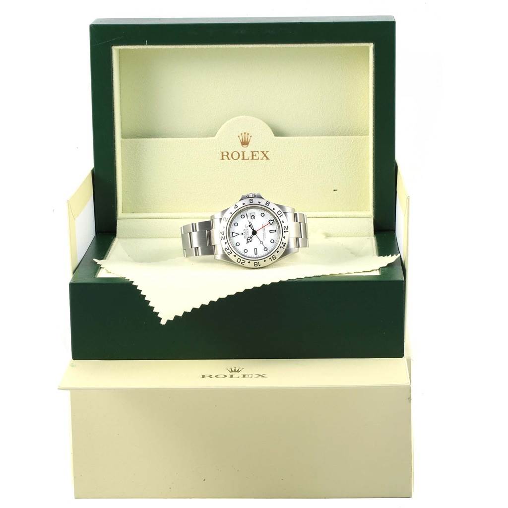 The image shows the front view of a Rolex Explorer 16570 Men's Stainless Steel White Dial 16570 Men's Stainless Steel White Dial watch inside an open Rolex box with its accessories.