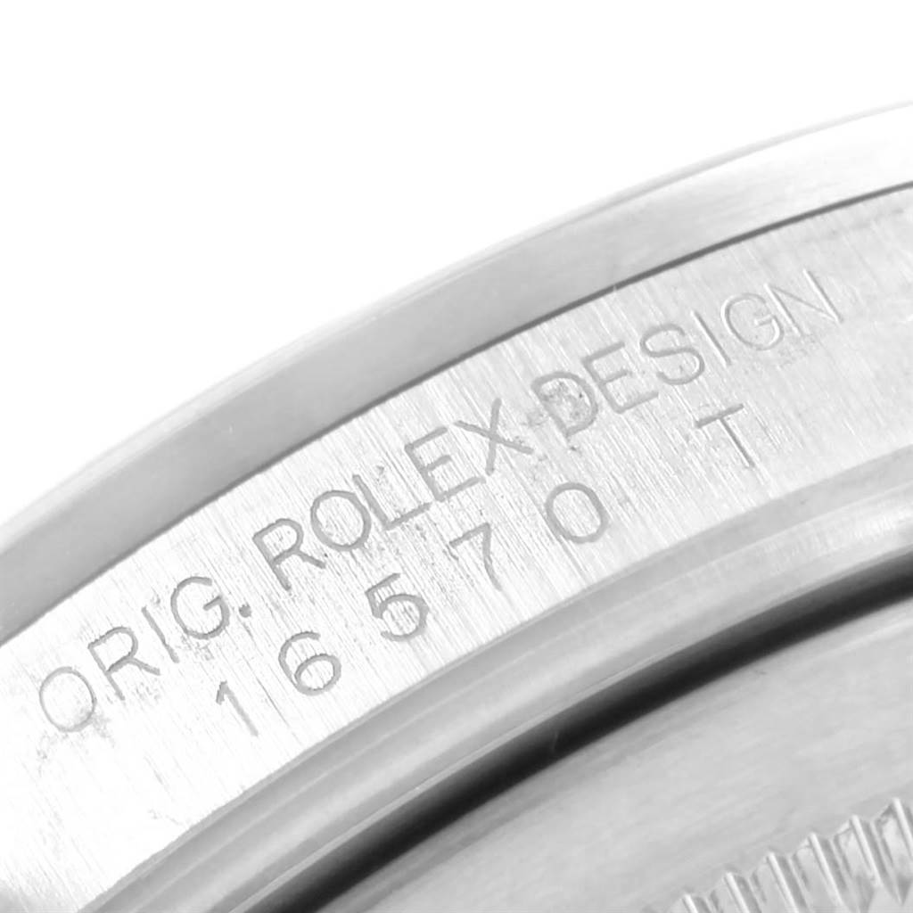 This image shows a close-up of the outer edge of the back casing of a Rolex Explorer 16570 Men's Stainless Steel Black Dial 16570 Men's Stainless Steel Black Dial watch, with model number engraving.