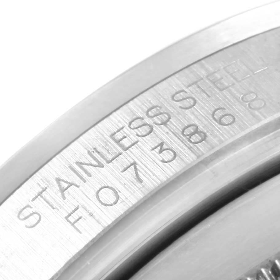This close-up image shows the engraving on the stainless steel of the Rolex Explorer 16570 Men's Stainless Steel Black Dial 16570 Men's Stainless Steel Black Dial watch case.
