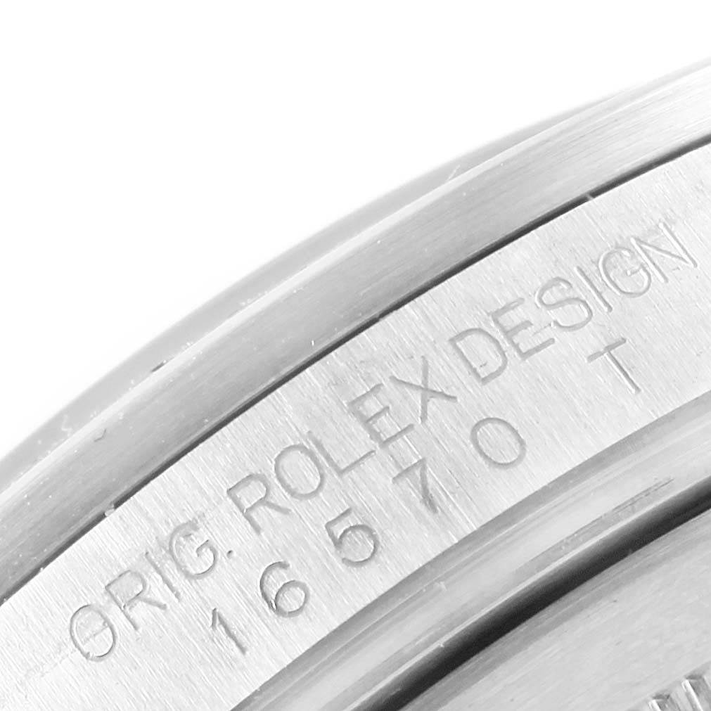 A close-up angle shows the engraved model number and "ORIG. ROLEX DESIGN" on the case of the Rolex Explorer 16677 Men's Stainless Steel Black Dial 16677 Men's Stainless Steel Black Dial watch.