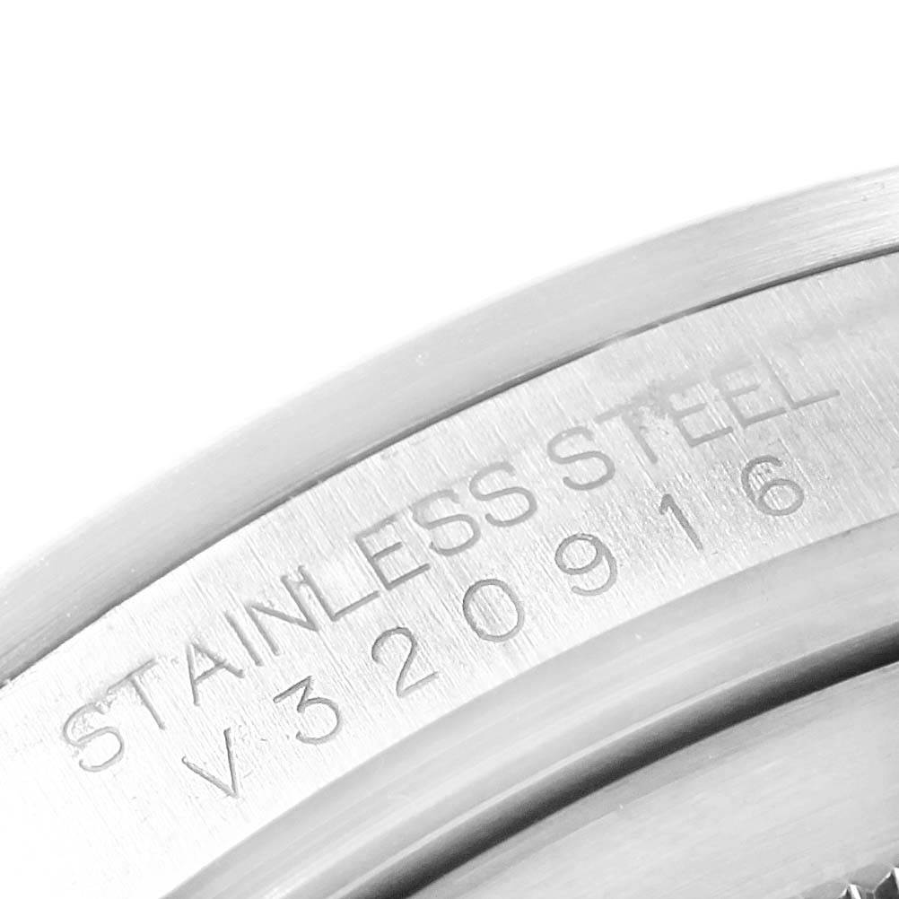 The close-up image shows the stainless steel case with the serial number of a Rolex Explorer 16677 Men's Stainless Steel Black Dial 16677 Men's Stainless Steel Black Dial watch.