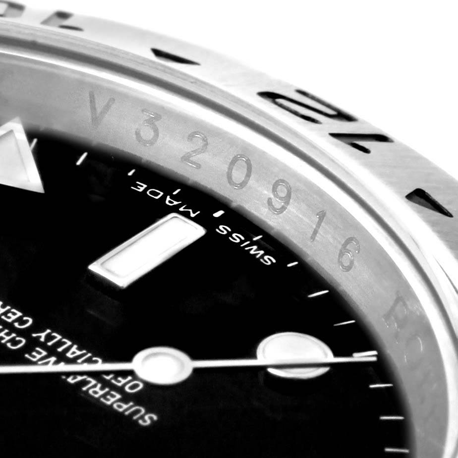 This is a close-up view of the dial and engraved bezel of a Rolex Explorer 16677 Men's Stainless Steel Black Dial 16677 Men's Stainless Steel Black Dial watch.