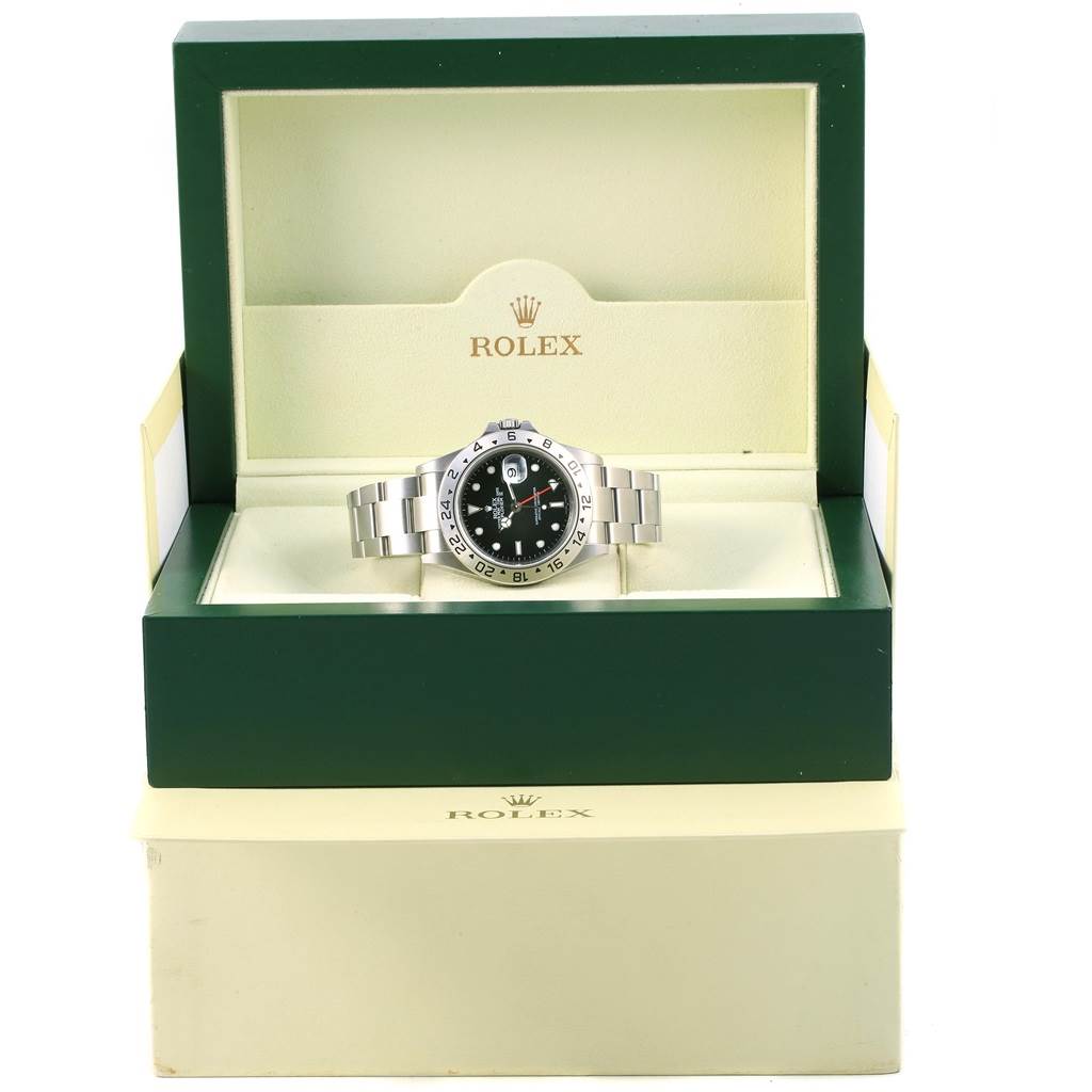 The Rolex Explorer 16677 Men's Stainless Steel Black Dial 16677 Men's Stainless Steel Black Dial watch is shown from a front angle, displayed in its open green and cream-colored box.
