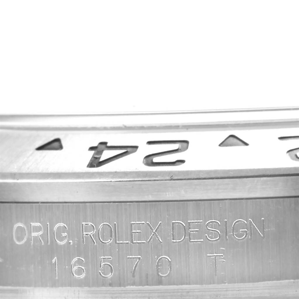 This image shows a close-up of the side of a Rolex Explorer 16570 Men's Stainless Steel White Dial 16570 Men's Stainless Steel White Dial watch, revealing its bezel and engraved model number 16570.