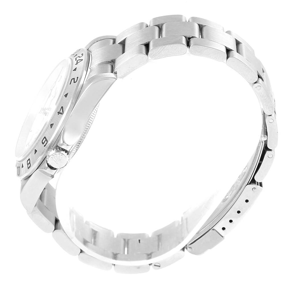 The Rolex Explorer 16570 Men's Stainless Steel White Dial 16570 Men's Stainless Steel White Dial watch is shown from a side angle, focusing on its bracelet, case, bezel, and crown.