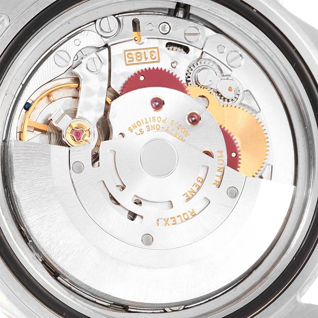 This image shows a close-up view of the movement inside a Rolex Explorer 16570 Men's Stainless Steel White Dial 16570 Men's Stainless Steel White Dial watch, displaying gears and other intricate components.