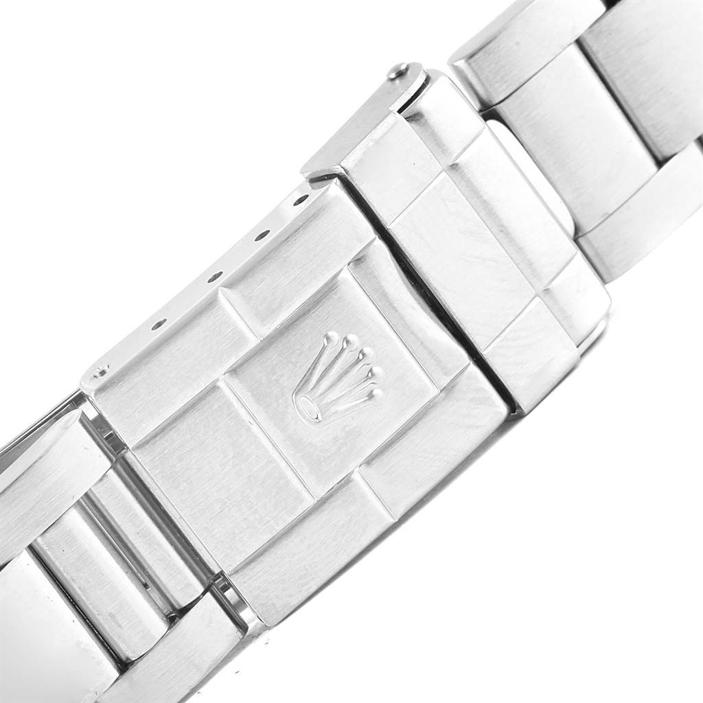 This image shows a close-up of the clasp and part of the bracelet band of the Rolex Explorer 16570 Men's Stainless Steel White Dial 16570 Men's Stainless Steel White Dial watch.