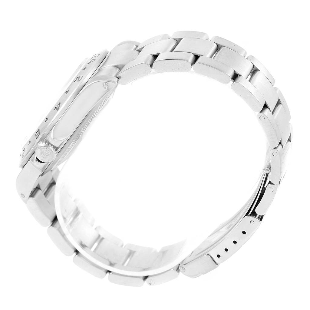 This side view of the Rolex Explorer 16570 Men's Stainless Steel White Dial 16570 Men's Stainless Steel White Dial watch shows the casing, crown, and part of the stainless steel bracelet.