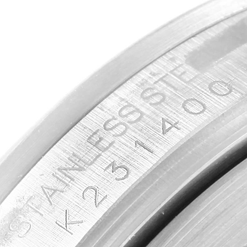 This close-up image shows the engraved stainless steel bezel or caseback of the Rolex Explorer 16570 Men's Stainless Steel White Dial 16570 Men's Stainless Steel White Dial watch.