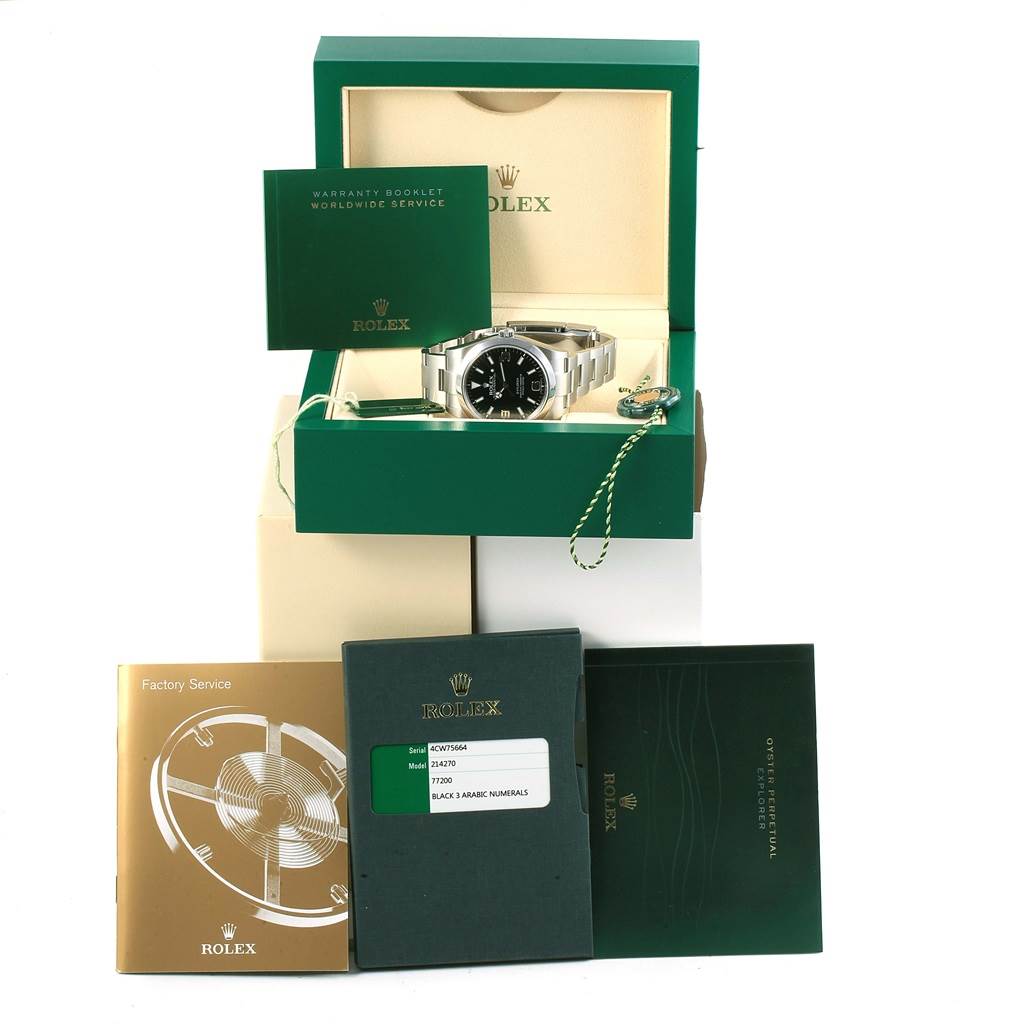 The image shows a Rolex Explorer 214270 Men's Stainless Steel Black Dial 214270 Men's Stainless Steel Black Dial watch in its box, accompanied by booklets and a warranty card, viewed from the front.