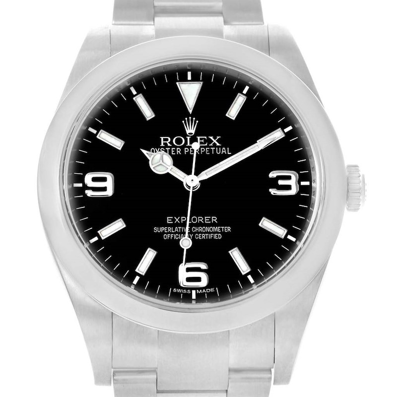 The image shows a front view of the Rolex Explorer watch, highlighting its black dial, stainless steel case, and bracelet.