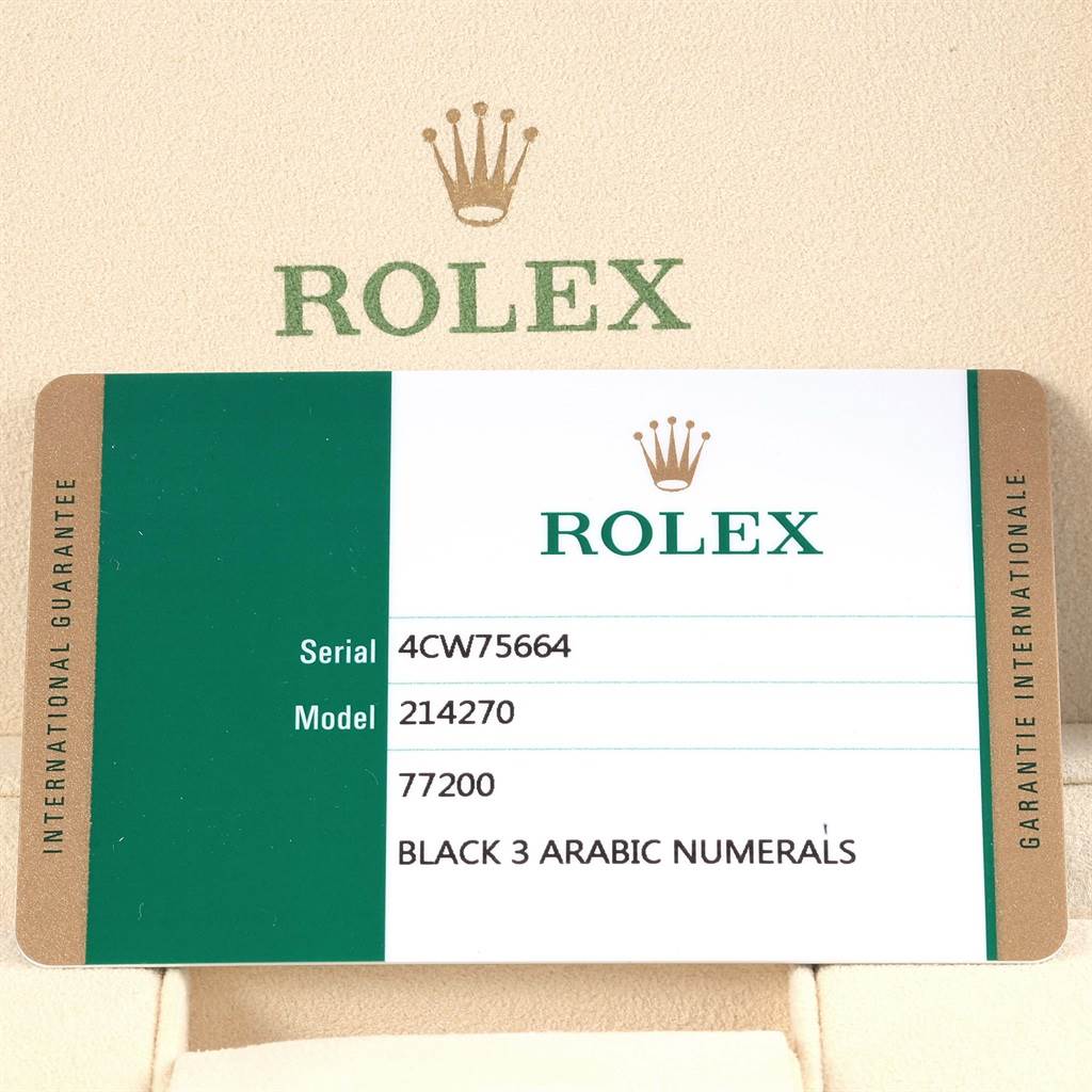 The image shows a Rolex Explorer 214270 Men's Stainless Steel Black Dial 214270 Men's Stainless Steel Black Dial model 214270 guarantee card displaying serial number, reference number, and dial description.