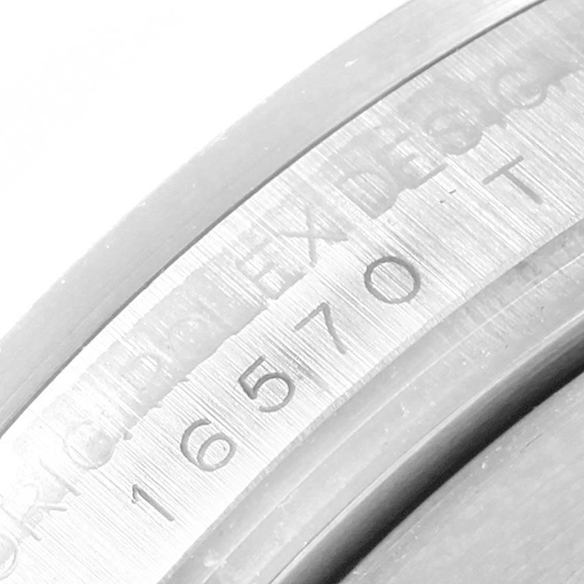The image shows a close-up of the Rolex Explorer 16570 Men's Stainless Steel Black Dial 16570 Men's Stainless Steel Black Dial watch, focusing on the engraved model number 16570 on the inner bezel.