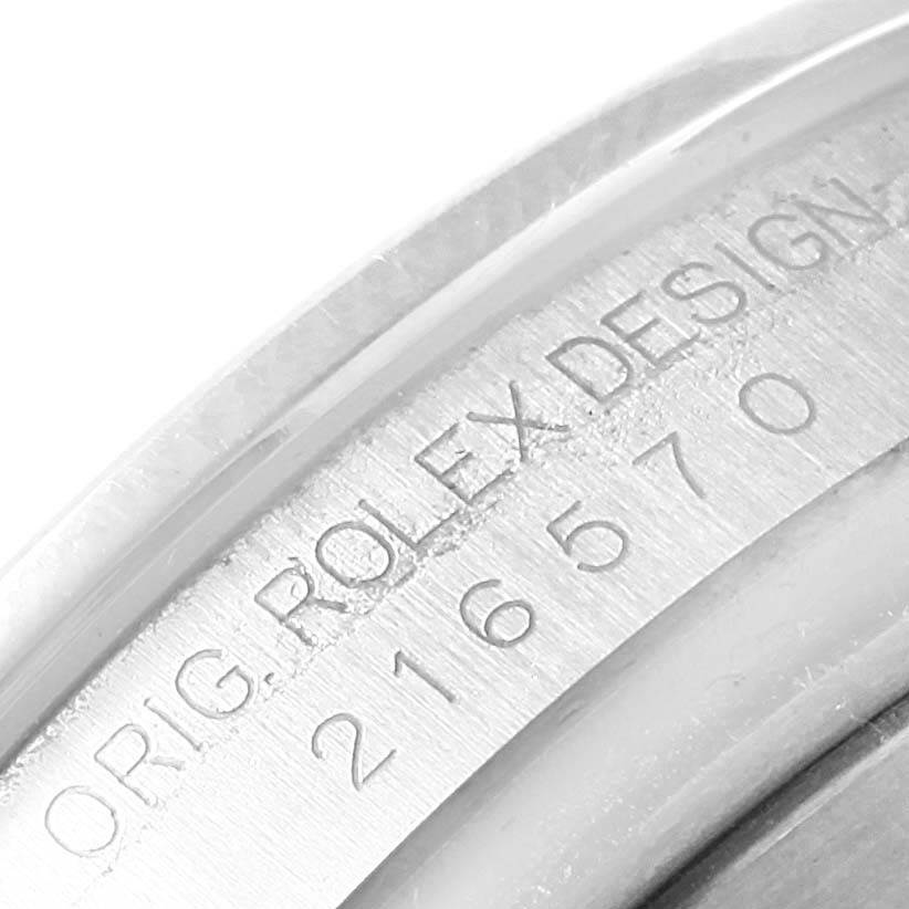 This image shows a close-up view of the case with engraving on the Rolex Explorer 216570 Men's Stainless Steel White Dial 216570 Men's Stainless Steel White Dial watch.