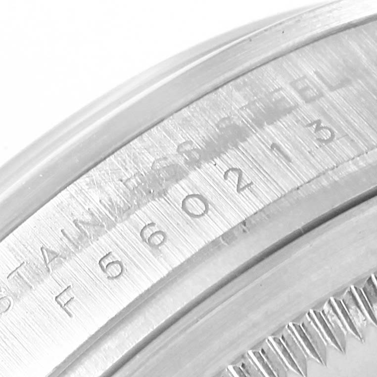 This close-up image shows the engraved stainless steel case number on a Rolex Explorer 114270 Men's Stainless Steel Black Dial 114270 Men's Stainless Steel Black Dial watch.