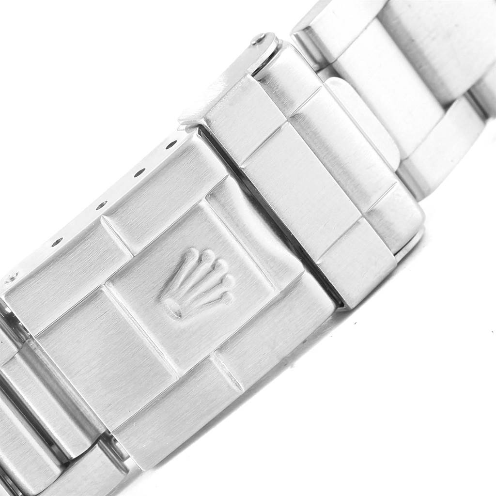 This close-up image shows the clasp of a Rolex Explorer 114270 Men's Stainless Steel Black Dial 114270 Men's Stainless Steel Black Dial watch band, featuring the Rolex crown logo.