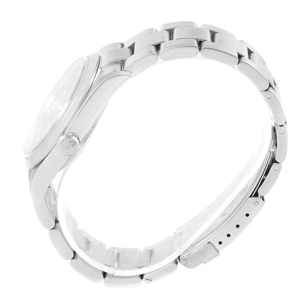 This image shows a profile view of the Rolex Explorer 114270 Men's Stainless Steel Black Dial 114270 Men's Stainless Steel Black Dial watch, highlighting its side, crown, and stainless steel bracelet.